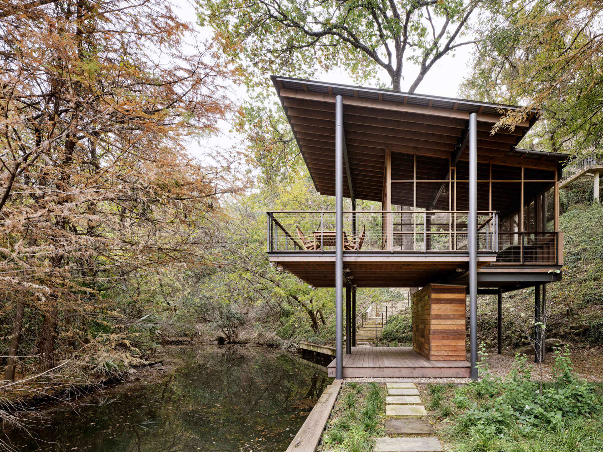 A modern structure designed for bird-watching and canoe/kayak storage, also provides access to the water.
