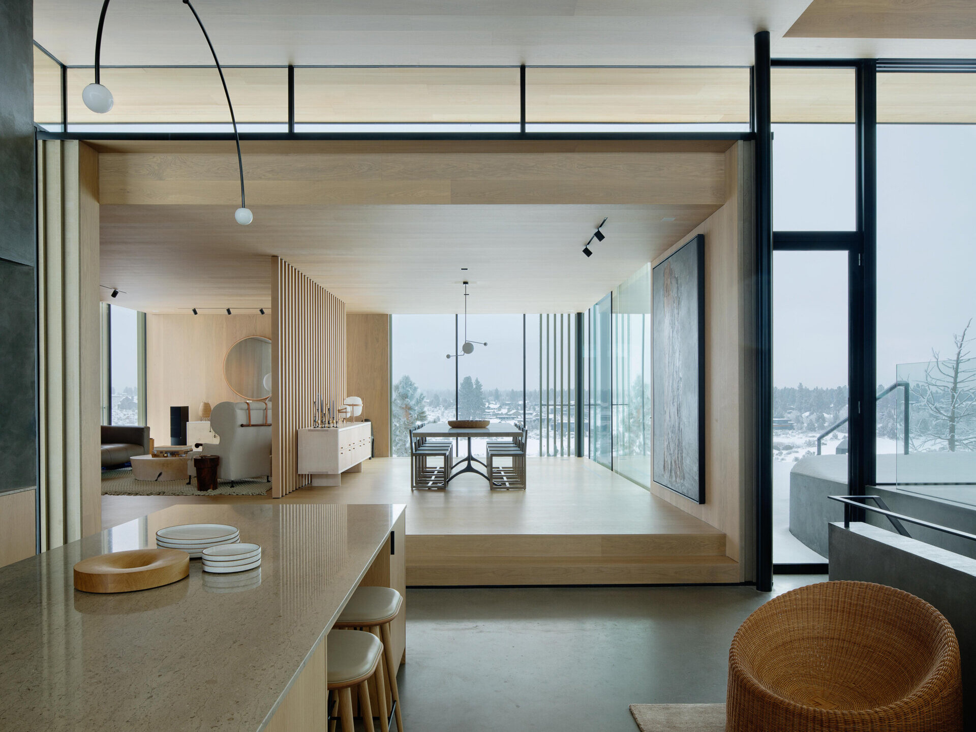 A few steps above the kitchen, the dining room sits in its own perched volume. Elevated and set apart, it enjoys sweeping views and a sense of occasion, making every meal feel like a special event.