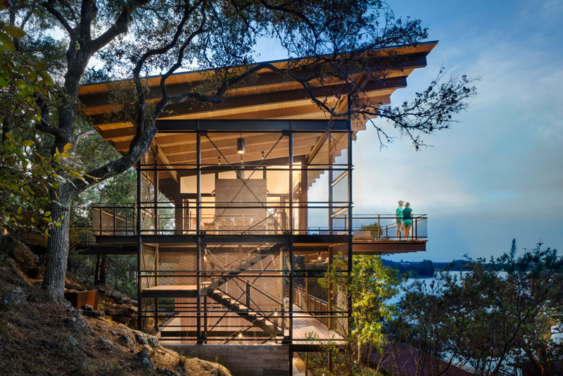  A lake house near Marble Falls with elevated living spaces that capture sweeping views of the water and treetops.