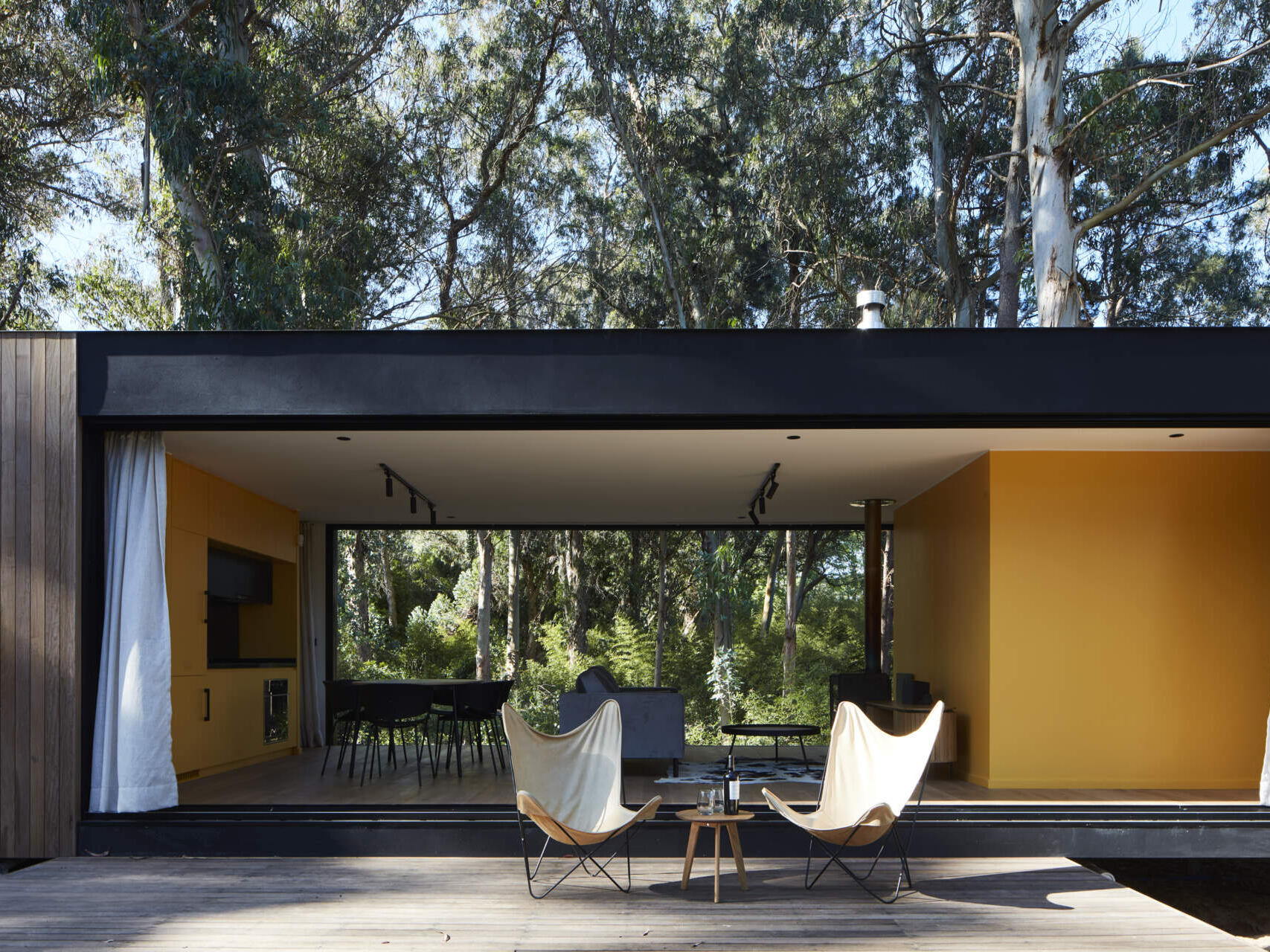 Drawing inspiration from mid-century single-family houses, this small forest home reinterprets classic ideas into a modern space where the inside and outside blend seamlessly.