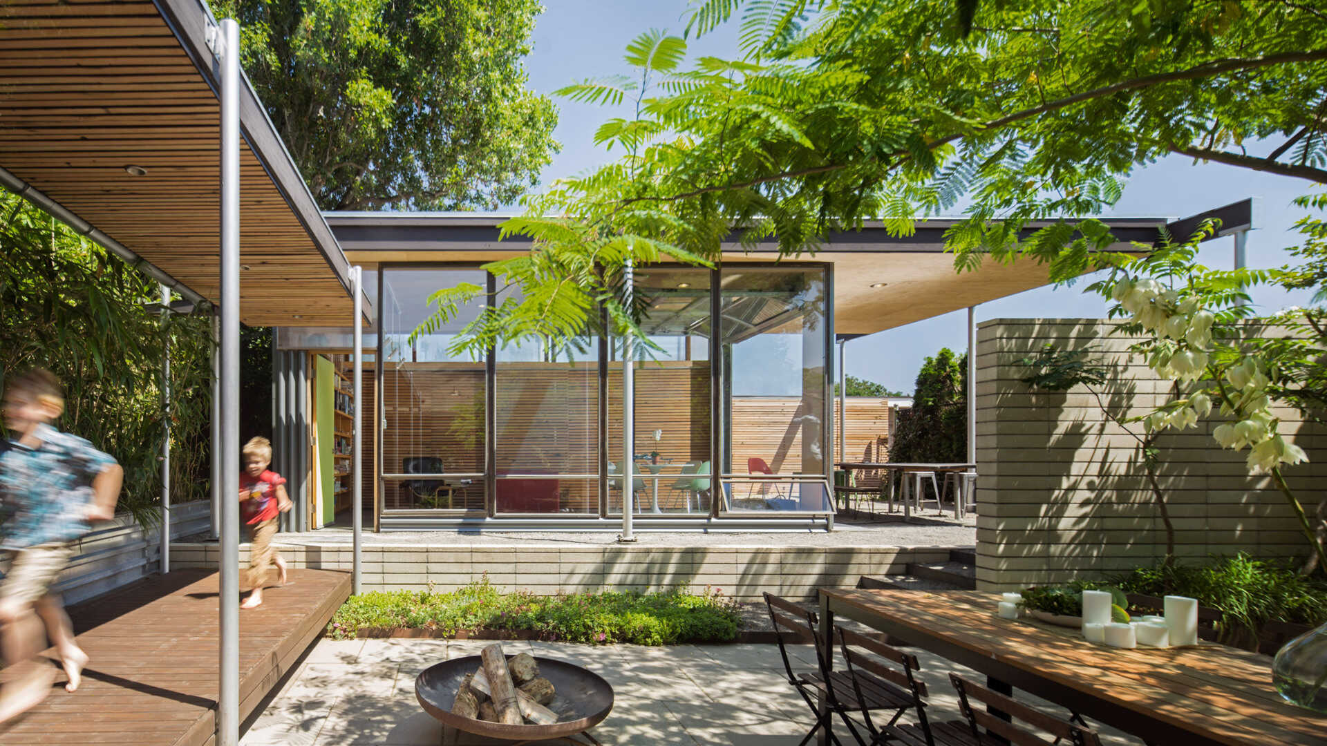 Smart placement of a compact studio transforms an older home without adding bulk.