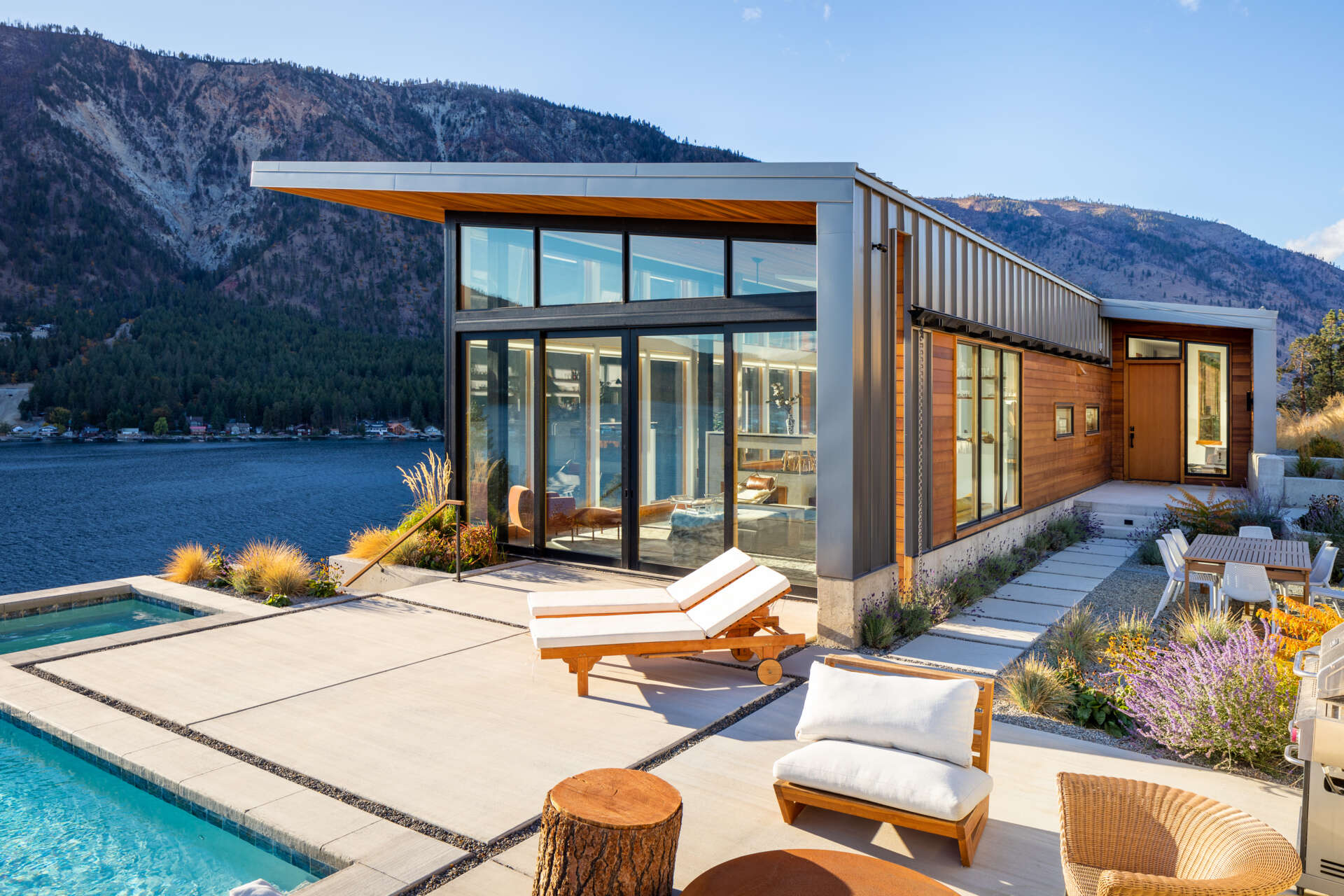 A contemporary design that uses terraces, steel, concrete, cedar, and thoughtful massing to create a durable home that blends with its rugged surroundings.