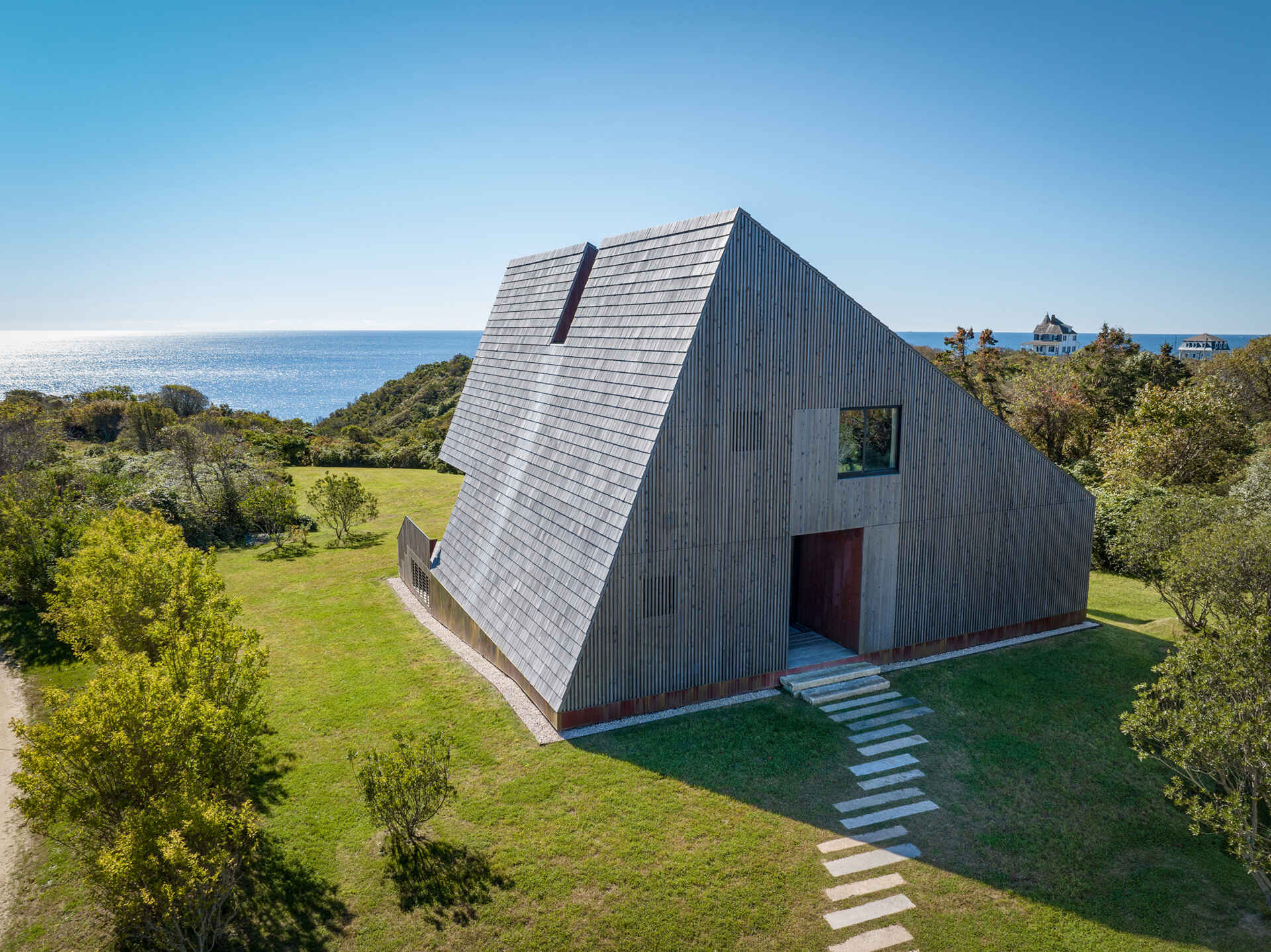 Crafted from cedar shakes, copper flashing, and hand-assembled timber, this coastal home proves that simple materials can create enduring architecture.